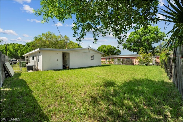 view of yard featuring central AC unit