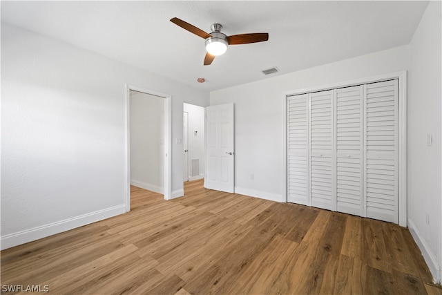 unfurnished bedroom with light hardwood / wood-style floors and ceiling fan