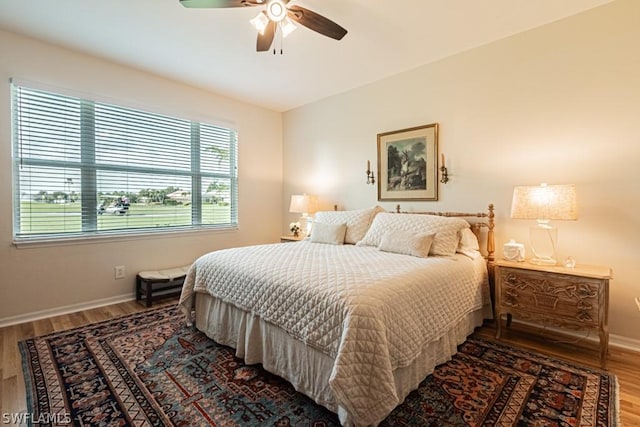 bedroom featuring hardwood / wood-style floors and ceiling fan