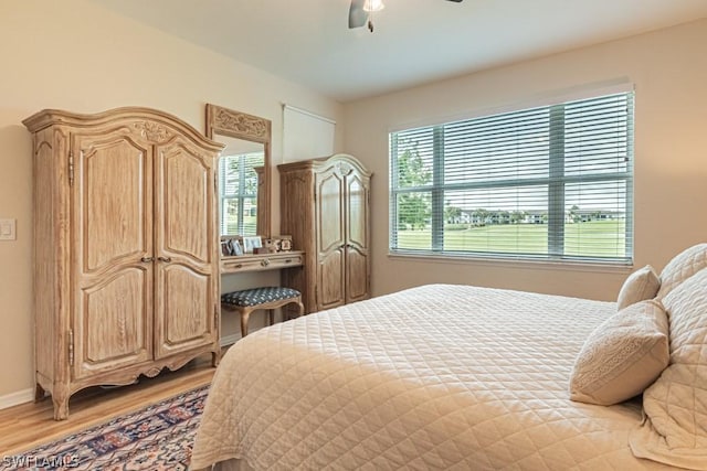 bedroom featuring hardwood / wood-style flooring and ceiling fan