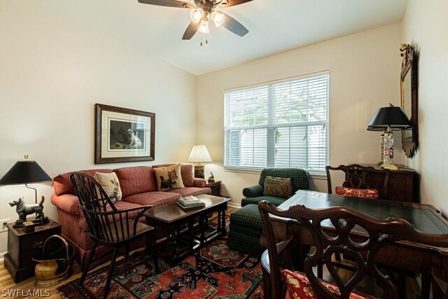 living room with hardwood / wood-style flooring and ceiling fan