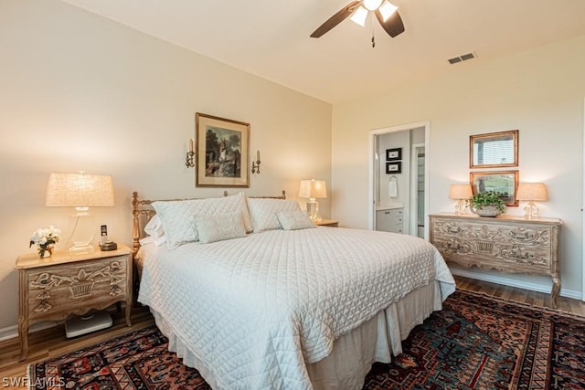 bedroom with hardwood / wood-style floors, ceiling fan, and ensuite bathroom