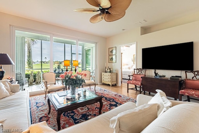 living room with ceiling fan and wood-type flooring