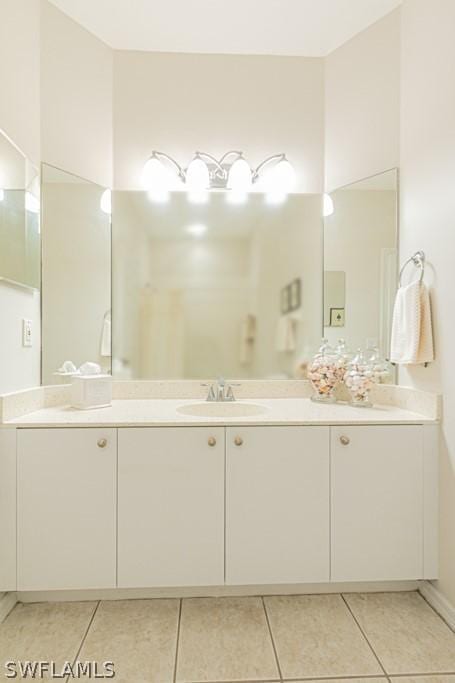 bathroom featuring vanity and tile patterned flooring