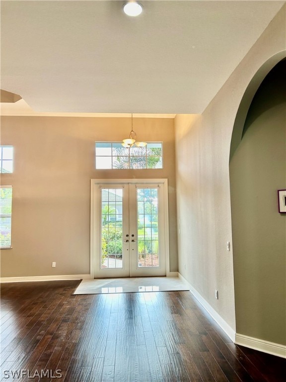 entrance foyer with french doors and dark wood-type flooring