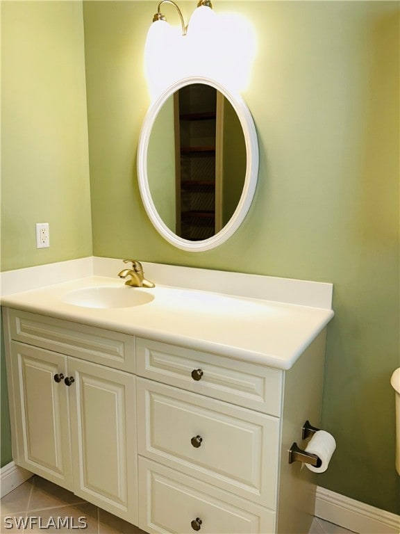 bathroom with vanity and tile patterned flooring