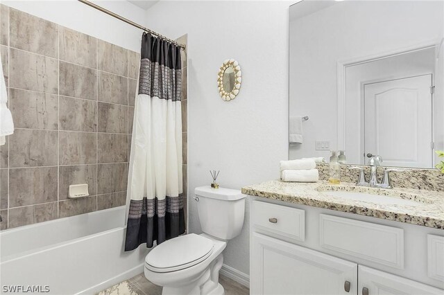 full bathroom featuring toilet, shower / bath combo, and vanity