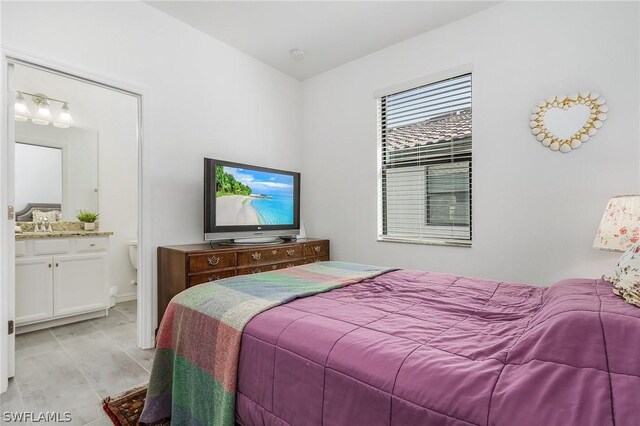 bedroom featuring connected bathroom