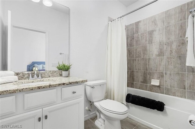 full bathroom featuring toilet, vanity, and shower / bath combination with curtain