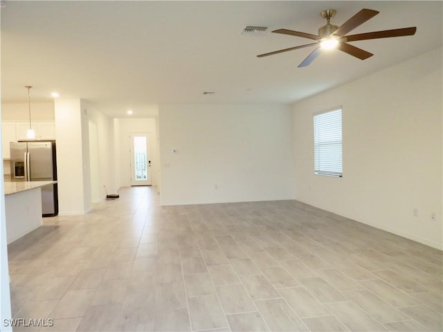 spare room with ceiling fan