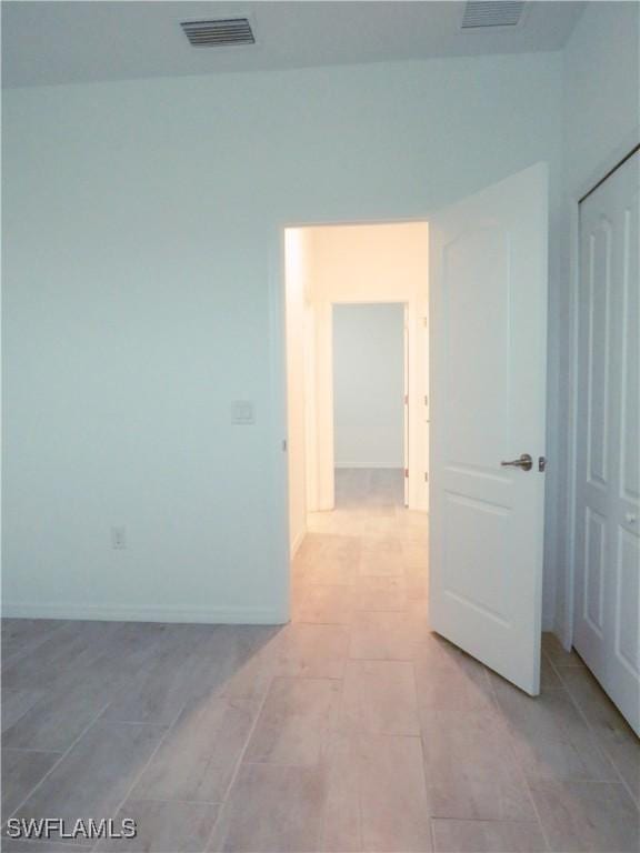 spare room with light tile patterned flooring