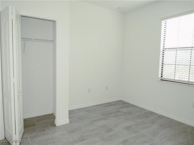 unfurnished bedroom featuring a closet