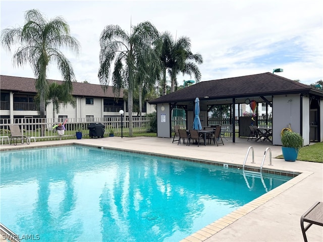 view of pool with a patio and a gazebo