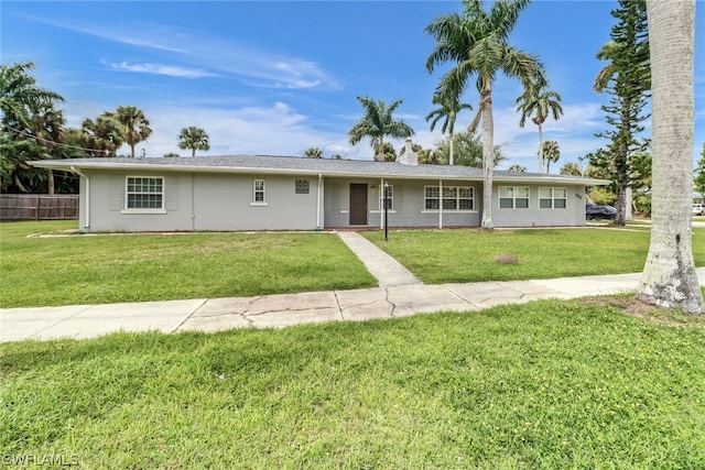 ranch-style house with a front lawn