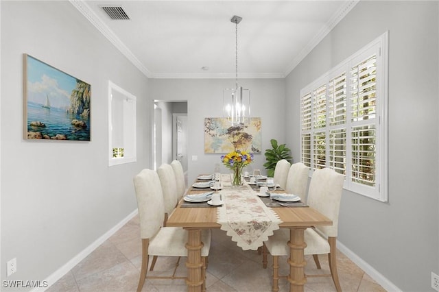 dining space with an inviting chandelier, light tile patterned flooring, and ornamental molding