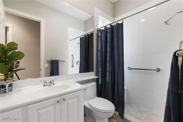 bathroom featuring a shower with curtain, vanity, and toilet