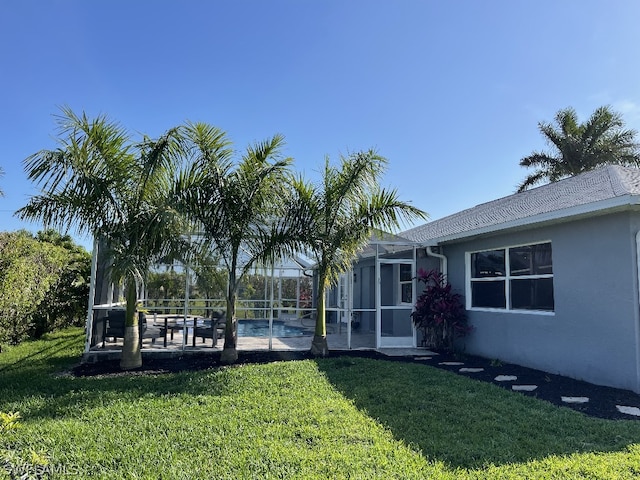 view of yard featuring a lanai