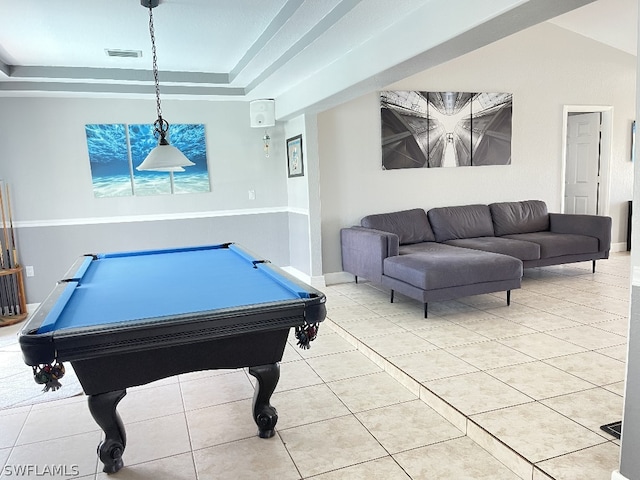 game room with a raised ceiling, billiards, and light tile floors