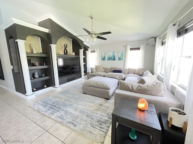 tiled living room with ceiling fan and built in shelves