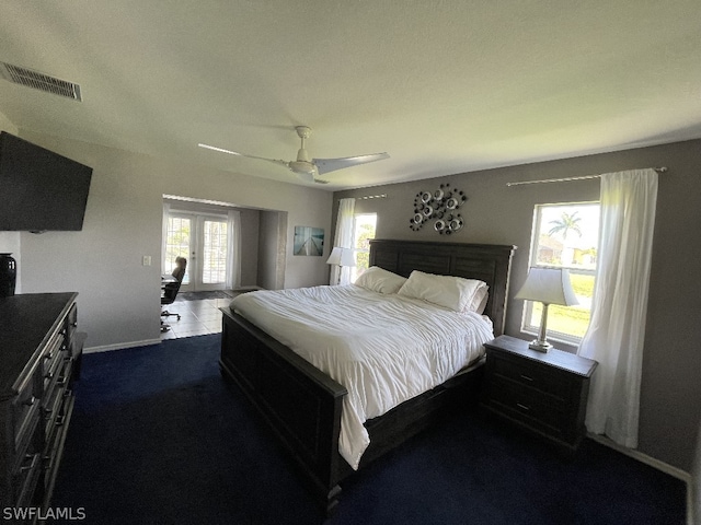 bedroom featuring dark tile floors and ceiling fan