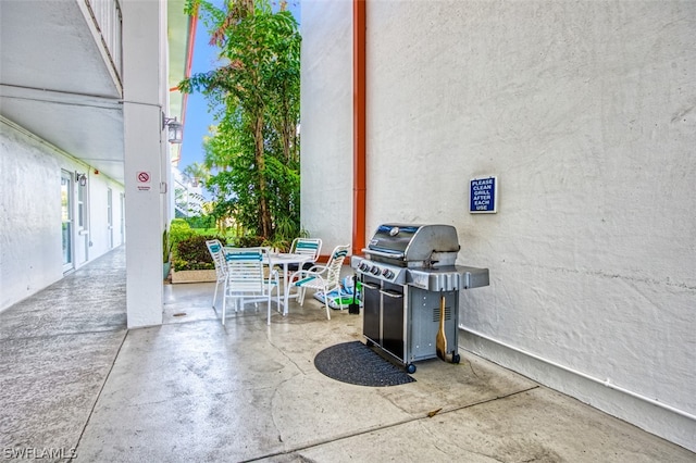 view of patio with a grill