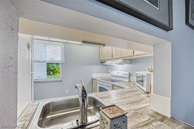 kitchen featuring white appliances and sink