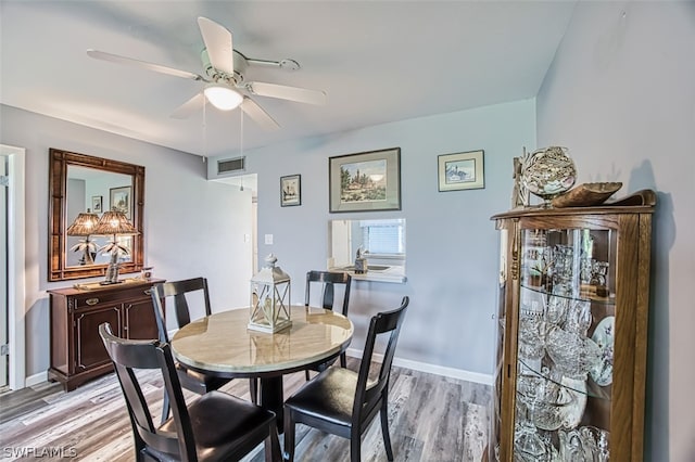 dining space featuring ceiling fan and light hardwood / wood-style floors