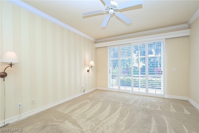 unfurnished room with ceiling fan, light carpet, and ornamental molding