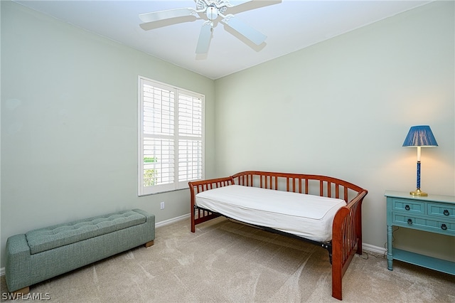 carpeted bedroom with ceiling fan