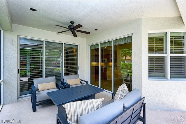 view of patio with ceiling fan and an outdoor living space