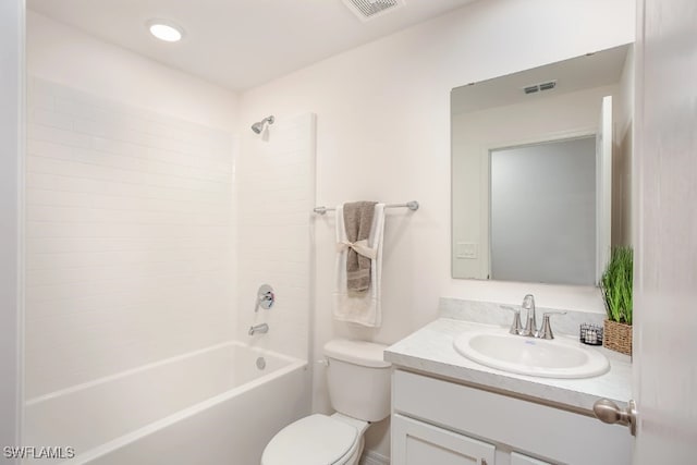 full bathroom with vanity, shower / tub combination, and toilet