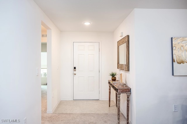 corridor with light tile patterned flooring