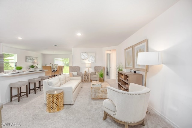 living room featuring light colored carpet