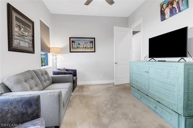 living room with ceiling fan and light colored carpet