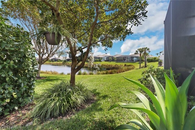 view of yard with a water view