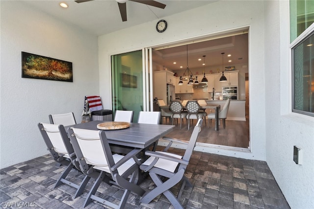 view of patio featuring ceiling fan