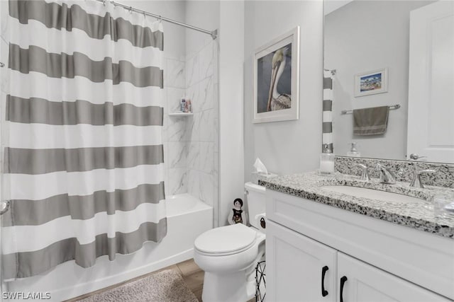 full bath featuring shower / tub combo with curtain, vanity, and toilet