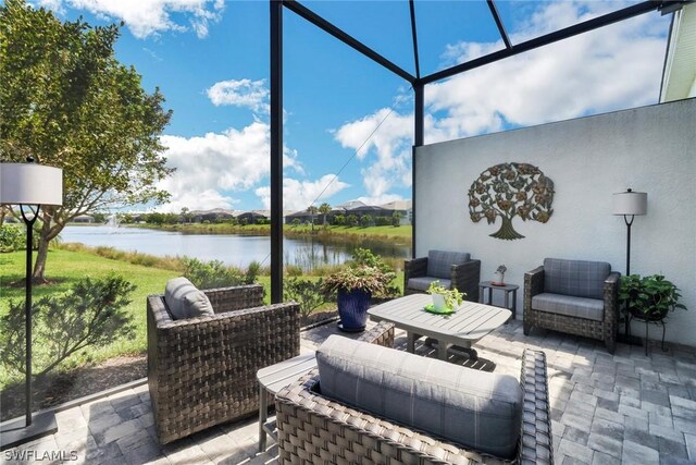 view of patio featuring a water view and a lanai