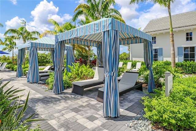 view of property's community featuring a patio and a gazebo