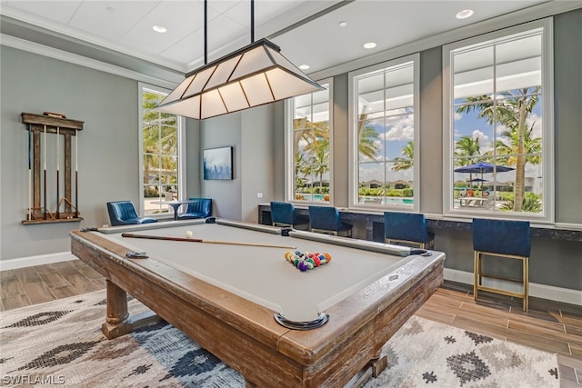 rec room with wood tiled floor, crown molding, and recessed lighting