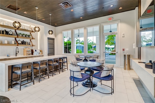 dining room with sink and wooden ceiling