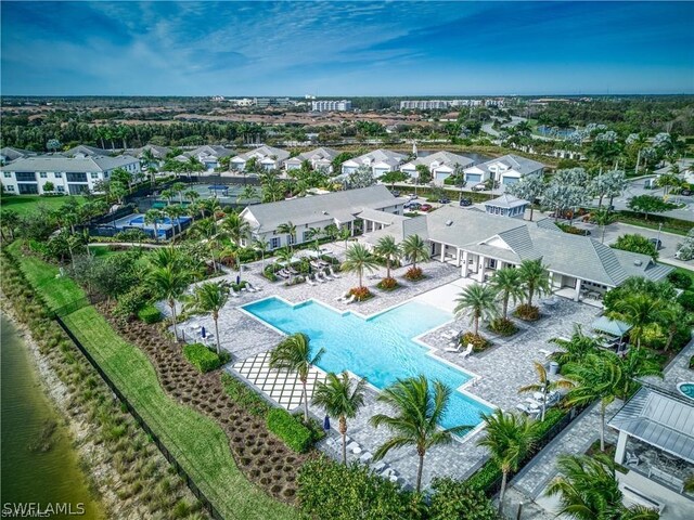 birds eye view of property with a water view