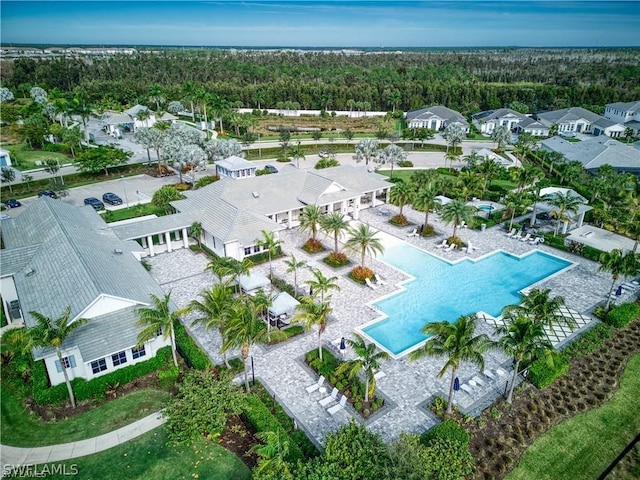 bird's eye view with a residential view and a wooded view