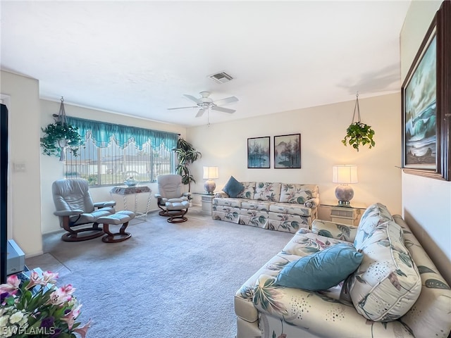 carpeted living room featuring ceiling fan