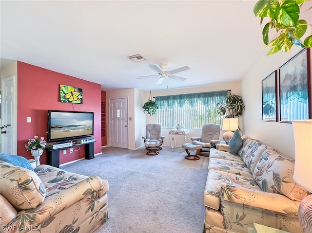 carpeted living room featuring ceiling fan