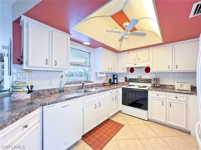 kitchen with backsplash, white appliances, ceiling fan, and white cabinetry