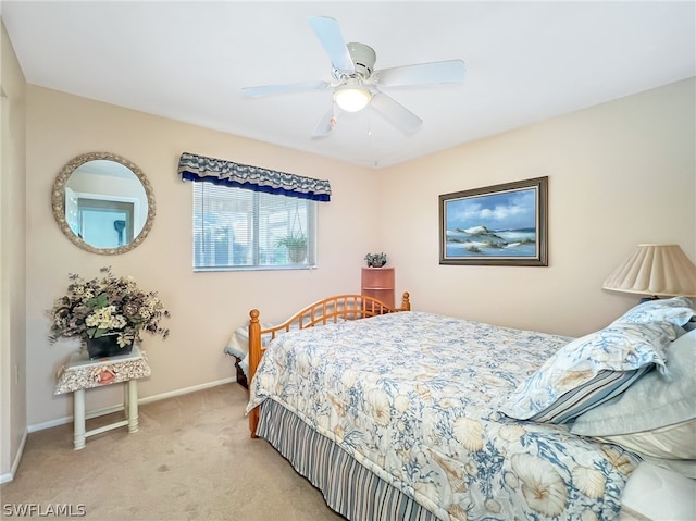 bedroom featuring ceiling fan and light carpet