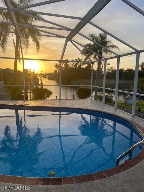 pool at dusk with glass enclosure