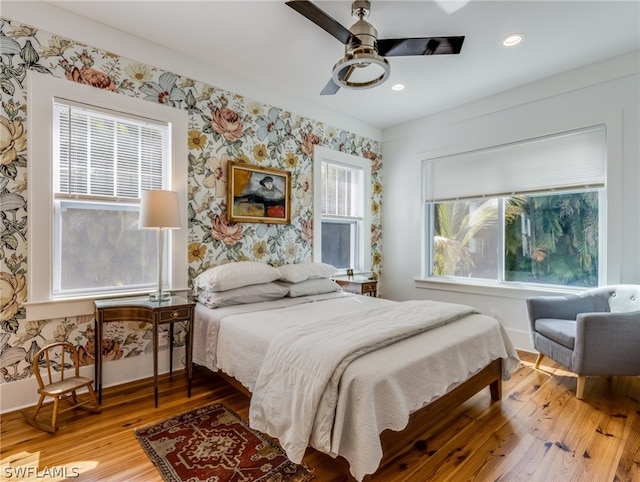 bedroom featuring light hardwood / wood-style floors and ceiling fan