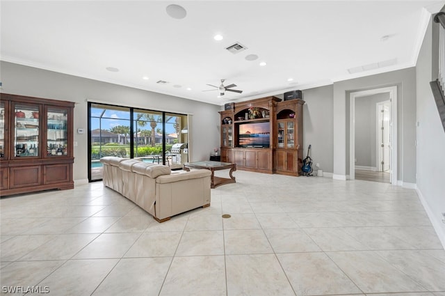 tiled living room with crown molding and ceiling fan